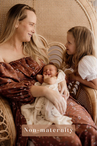 We Are Reclamation Autumn Meadow Satin Gown worn by a non-pregnant lady in a family photoshoot