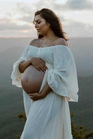 We Are Reclamation Ruffle Me Open Gown Buttercream - Maternity Dress Hire - Elasticated waist and shoulders, can be styled on or off the shoulder, and perfect for showcasing your bump.