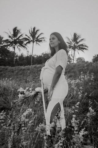 Beautiful pregnant mama wears the Hazel and Folk Melody Maxi in buttercream