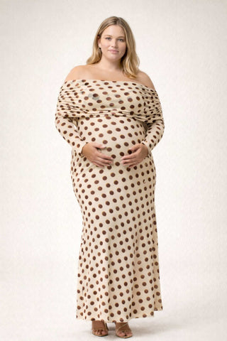 A pregnant lady wearing the AFRM Thelma Off Shoulder Mesh Maxi Dress in a photoshoot.