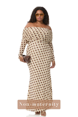A non-pregnant lady wearing the AFRM Thelma Off Shoulder Mesh Maxi Dress in a photoshoot.