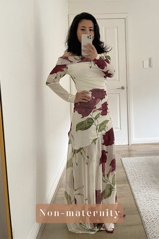 A non-pregnant woman wearing the By Nicola Belle Maxi Dress in Bordeaux Floral.