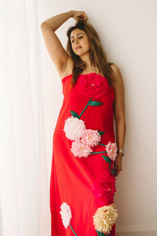 A lady wearing the Mama Rentals Elliatt Buttercup Embroidered Maxi Dress in a studio.
