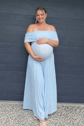 A pregnant lady wearing the Lioness Field of Dreams Maxi Dress in Soft Blue for her baby shower.