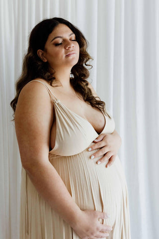 Comfortable maternity wear for photoshoots: We Are Reclamation Everyday Is Joy Slip Dress - maternity dress hire Australia